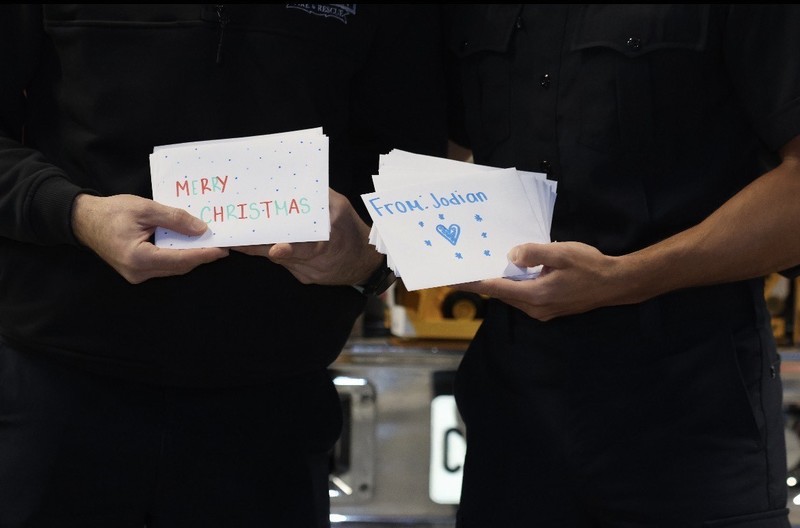 Closeup photo of the holiday cards designed by Madonna students