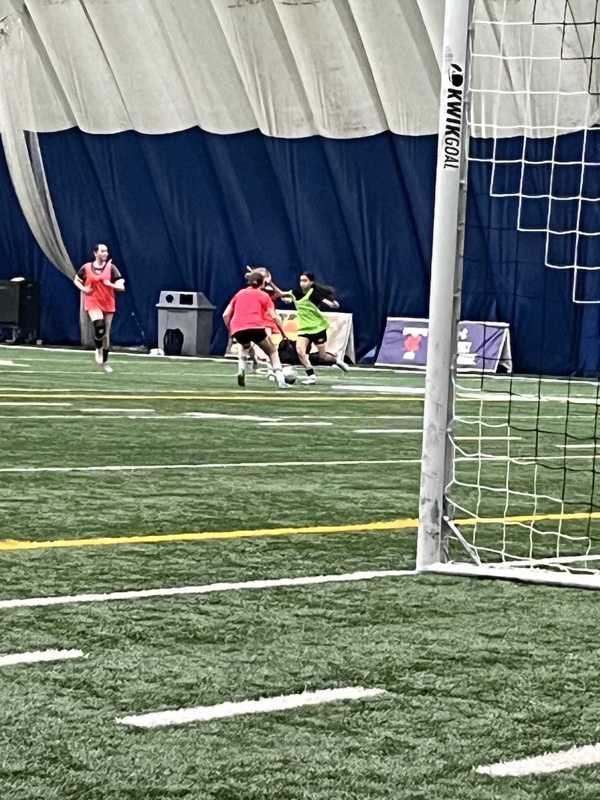 Photo of Cecilia playing on the soccer field