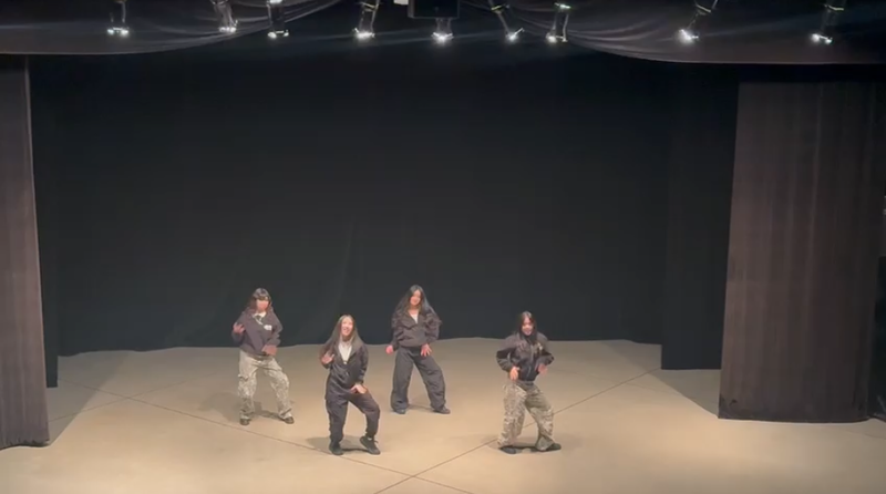 Photo of Loretto College School students performing on stage