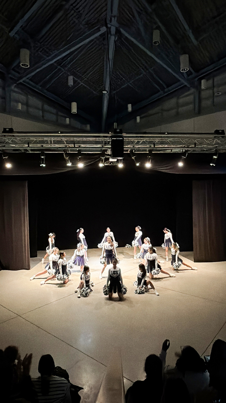 Photo of Loretto College School students performing on stage