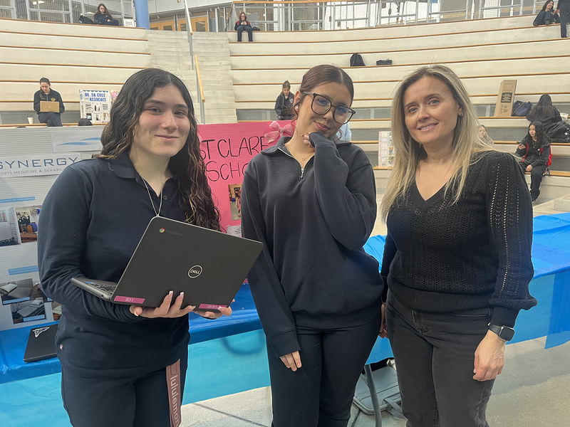 Photo of students at the fair with their presentation on their co-op experience