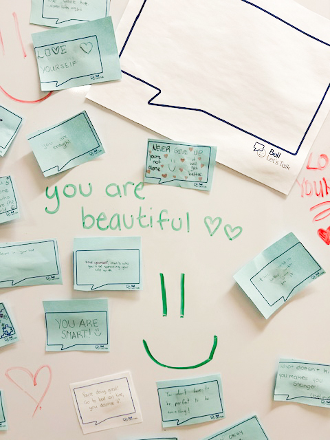 Photo of the board with positive messages stuck on it