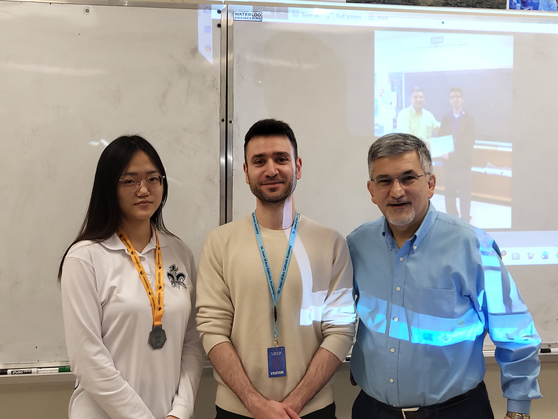 Photo of Suyeon wearing her medal, along with Yamn and Mr. Raymond Sarkissian