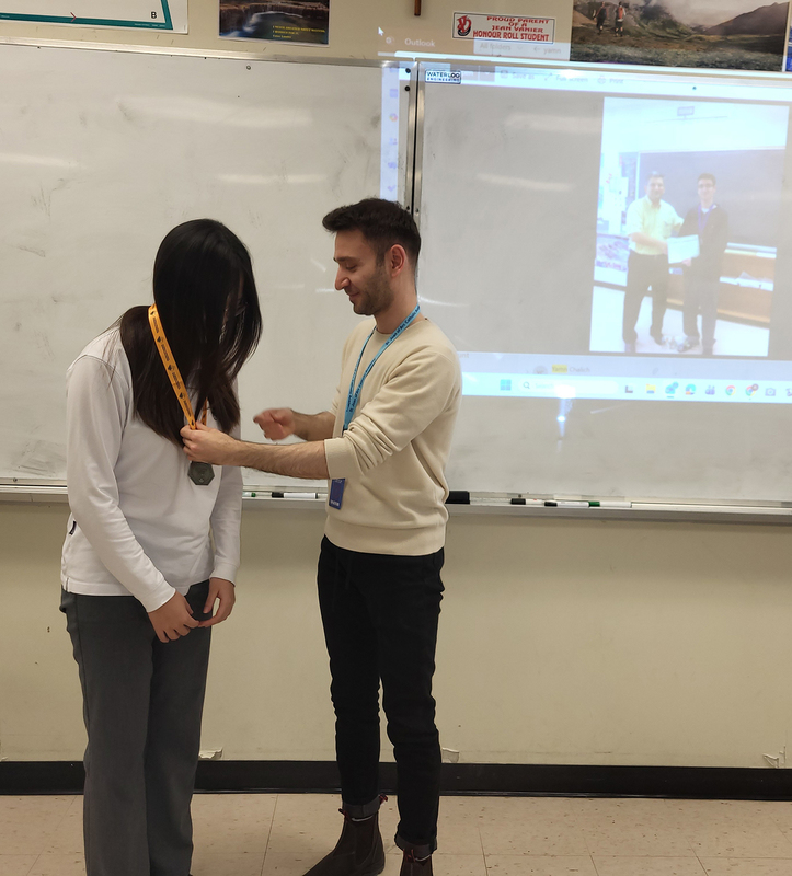 Photo of Suyeon being given her medal by Yamn 