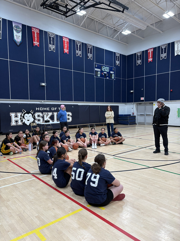 Photo of the teams on the court