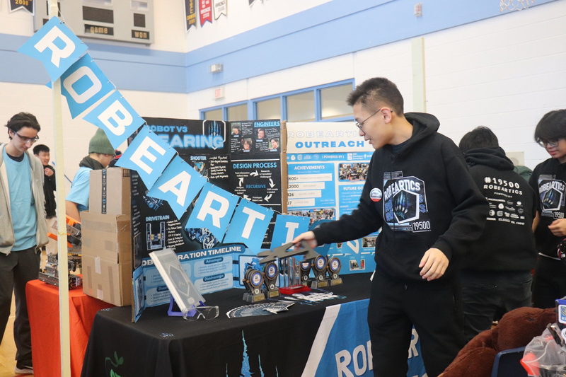 Photo of students working on their robotics build