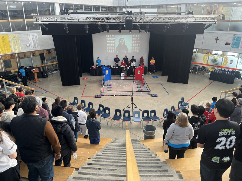 Photo of students presenting their robotics build