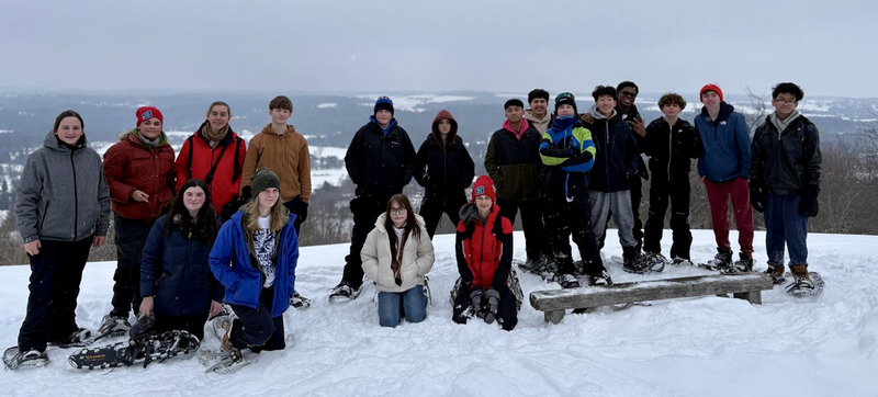 Photo of students and staff at the camp retreat