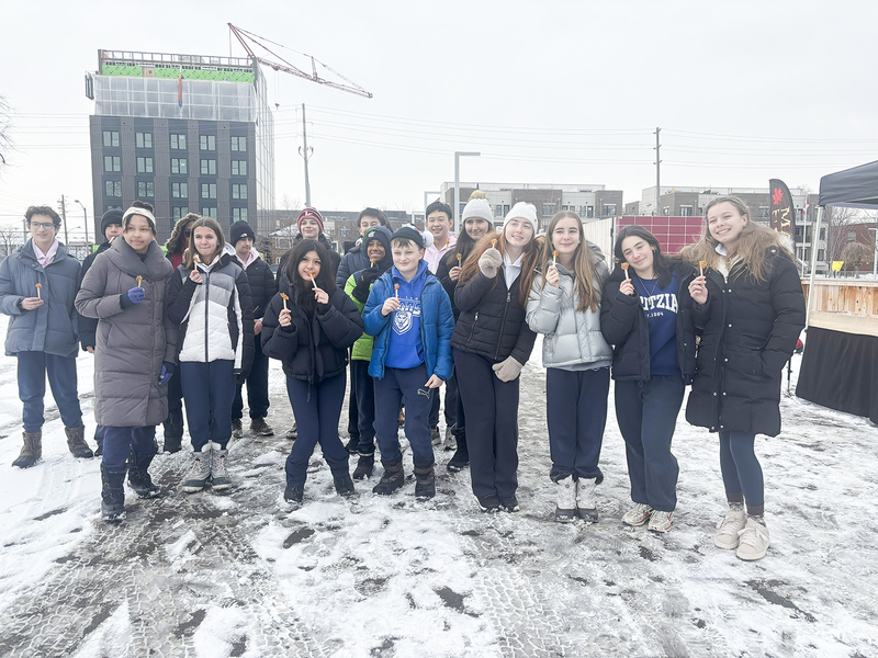 Photo of students enjoying their maple taffy