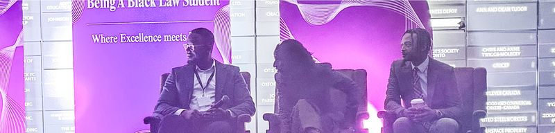 Photo of two law professionals speaking at the podium during the event