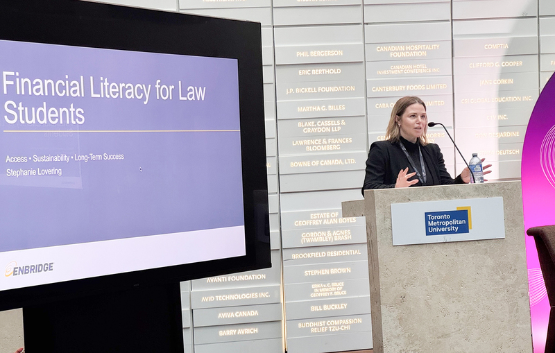 Photo of two law professionals speaking at the podium during the event