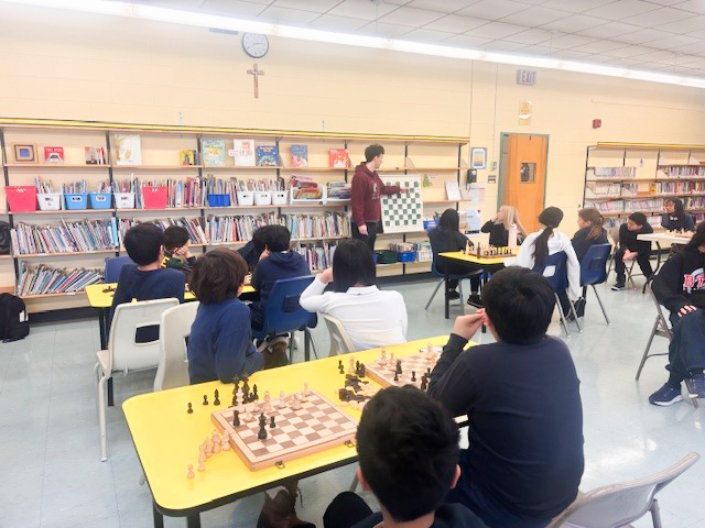 Photo of Blessed Trinity students playing chess during the club