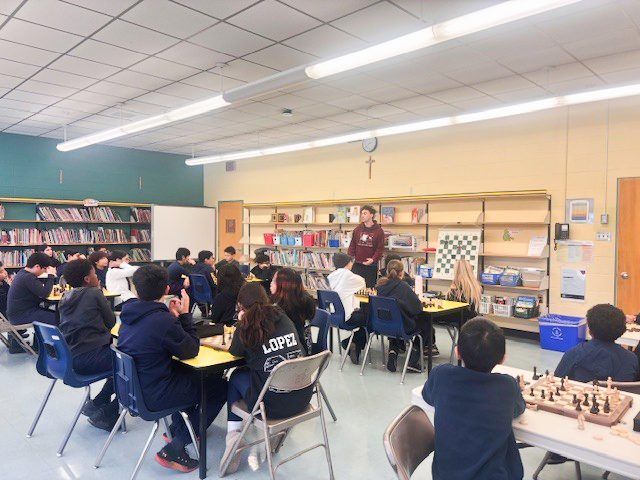 Photo of Blessed Trinity students playing chess during the club