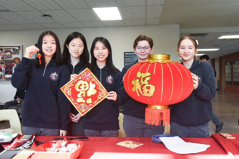 Photo of Redmond friends with Lunar New Year decorations and ornaments in red and gold