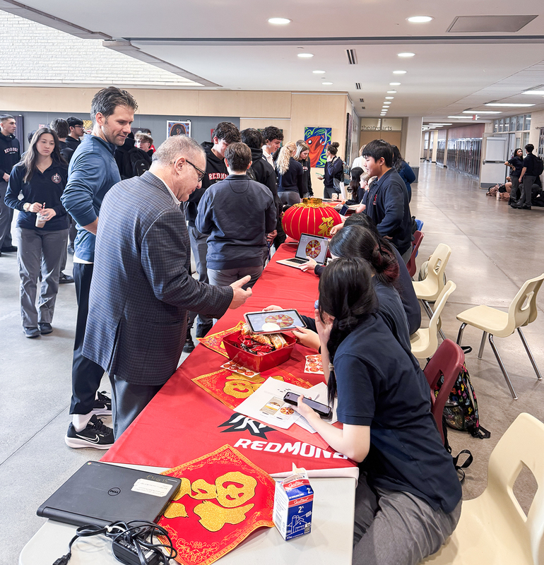Students and attendees at the Lunar New Year display tables