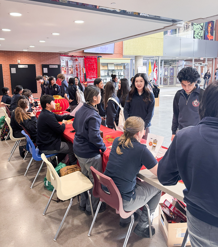 Students and attendees at the Lunar New Year display tables