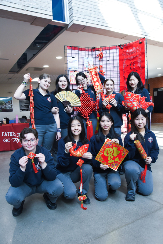 Photo of Redmond friends with Lunar New Year decorations and ornaments in red and gold