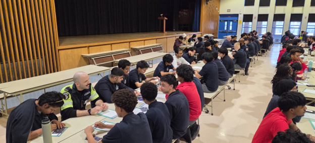 Photo of SJOA students conversing with coaches during the event