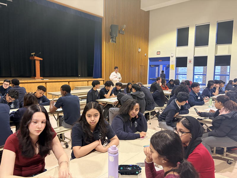 Photo of SJOA students conversing with coaches during the event