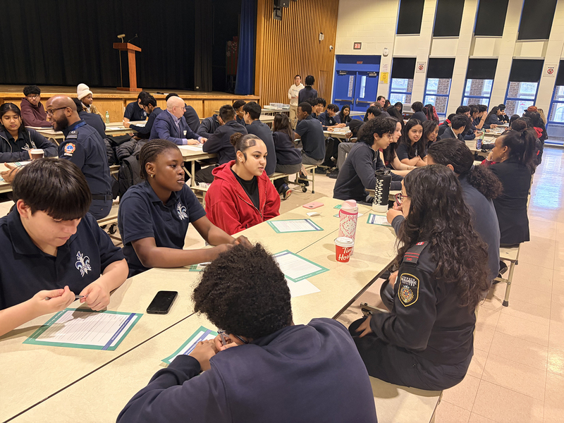 Photo of SJOA students conversing with coaches during the event