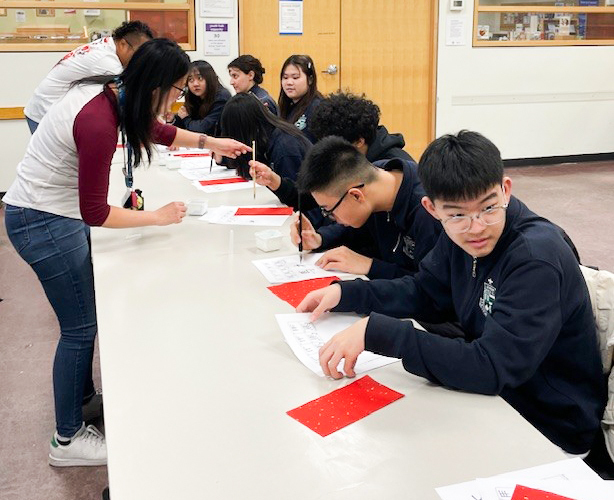 Photo of Libermann students working on their calligraphy