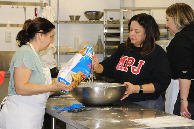 Photo of MPJ community members making pancakes