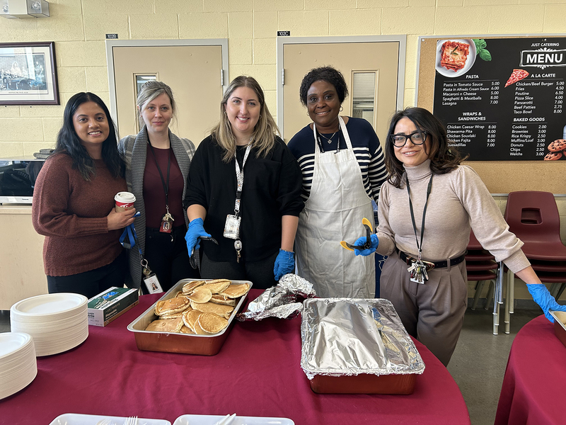 Photo of MPJ community members serving breakfast