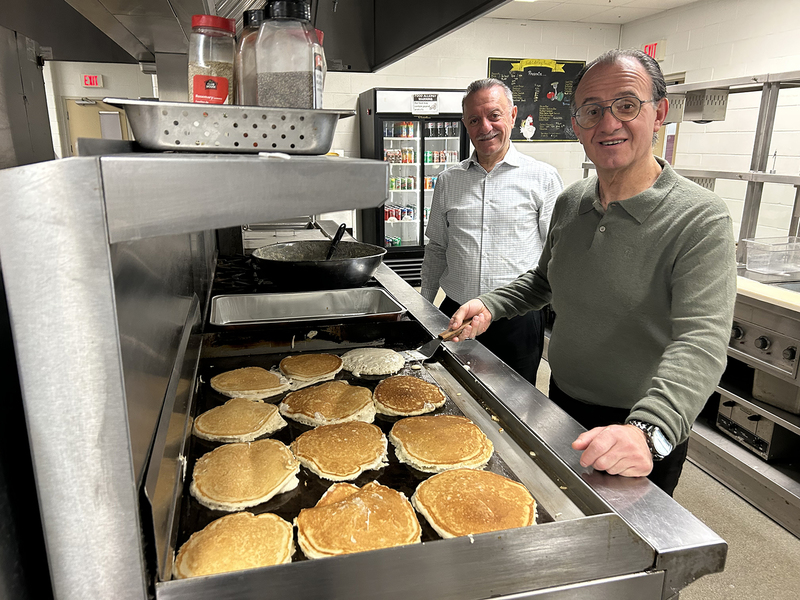Photo of MPJ community members making pancakes