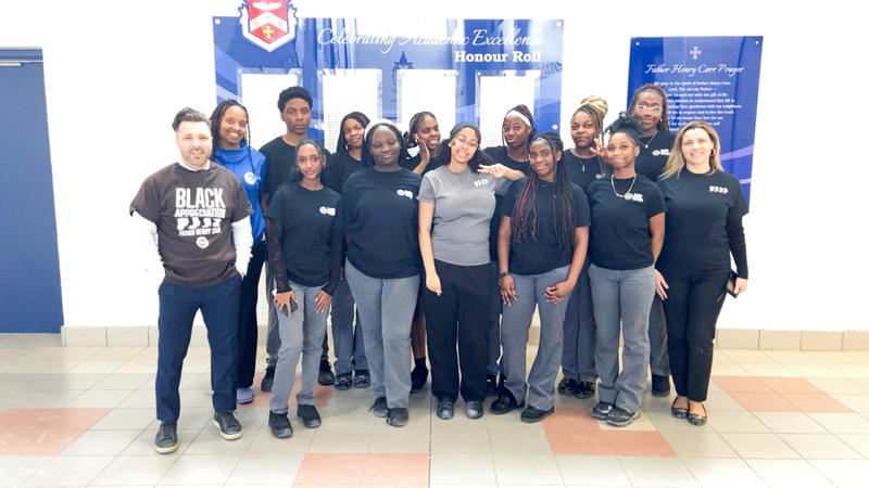 Group photo of the Father Henry Carr Black Students Association with their lead teachers