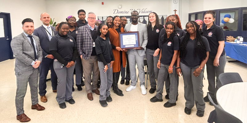 Photo of Father Henry Carr and TCDSB students and staff with their Exemplary Practice Award for the first TCDSB Black Career Fair