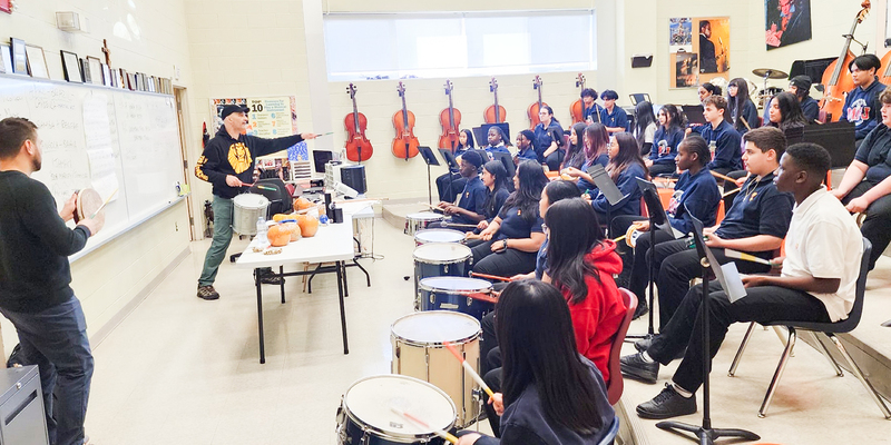 Photo of MPJ music students learning from Mr. Steve Mancuso