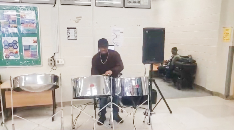 Photo of Winston 'Pappy' Frederick playing the steel pan
