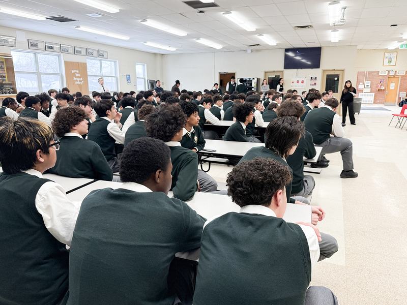 Photo of Chaminade students listening to the speech