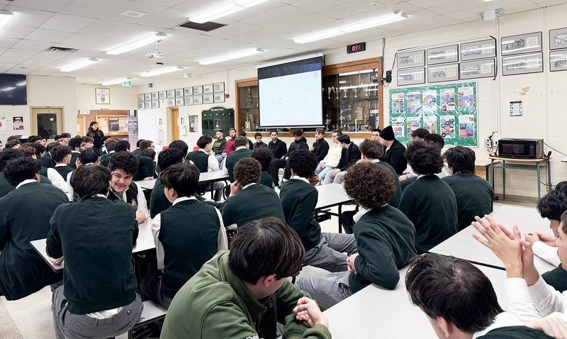 Photo of Chaminade students listening to the speech