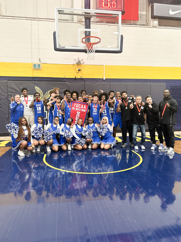 Group photo of FHC team players, cheerleaders, coaches and staff