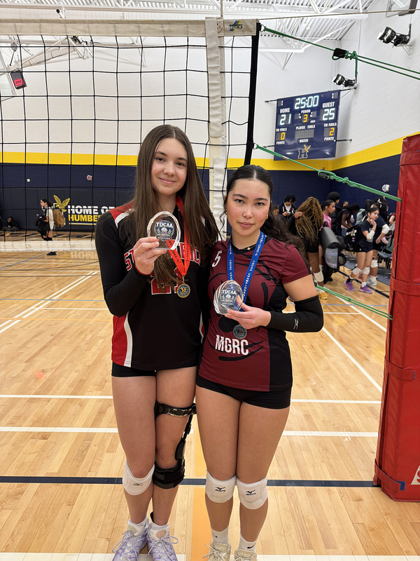 Photo of Sophia from St. Patrick and Naomi from Charbonnel with their awards