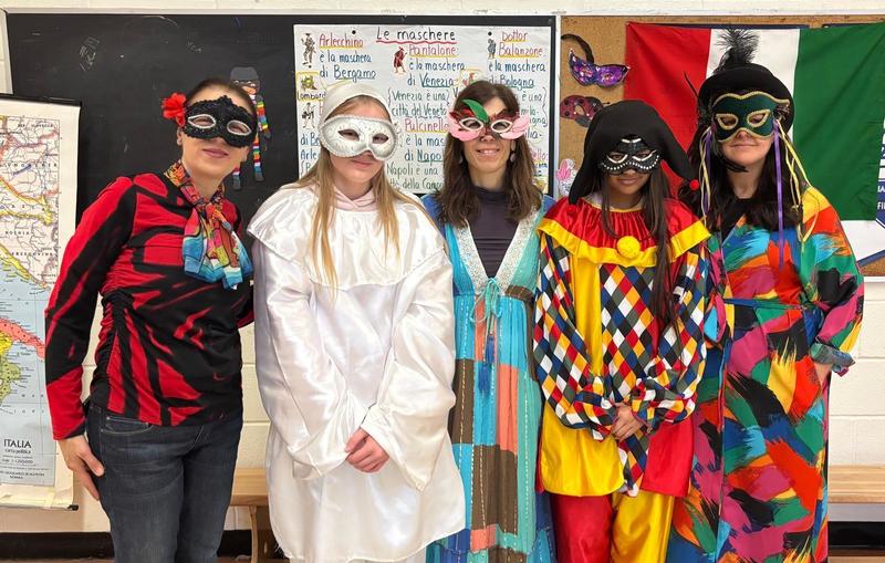 Photo of staff with masks and costumes