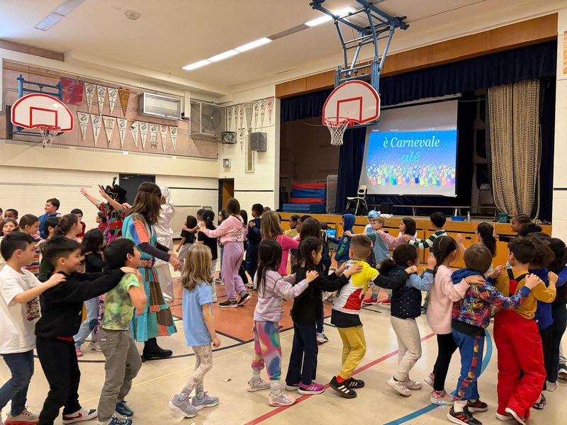 Photo of students doing a line dance during the celebrations