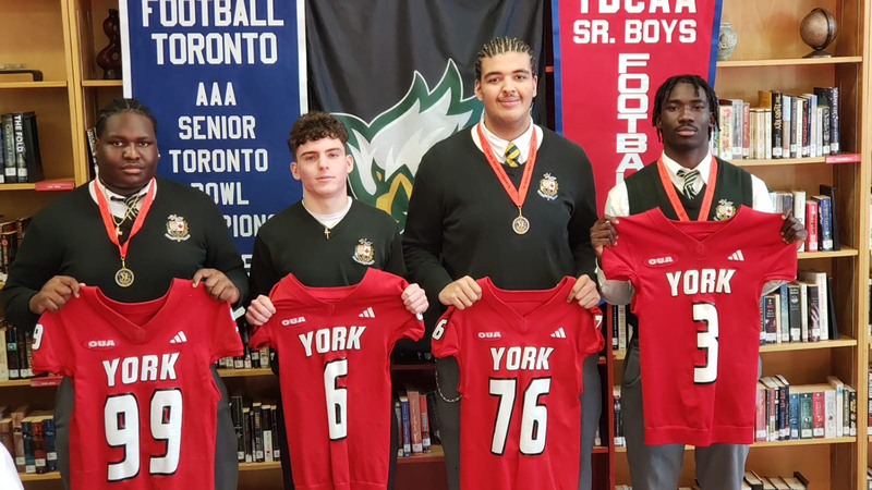 Photo of Chaminade students committed to York with their York U jerseys