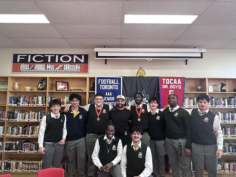 Photo of Chaminade students with their championship banners