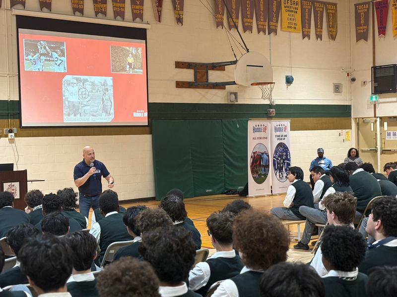 Photo of Chaminade students listening to speaker at the assembly