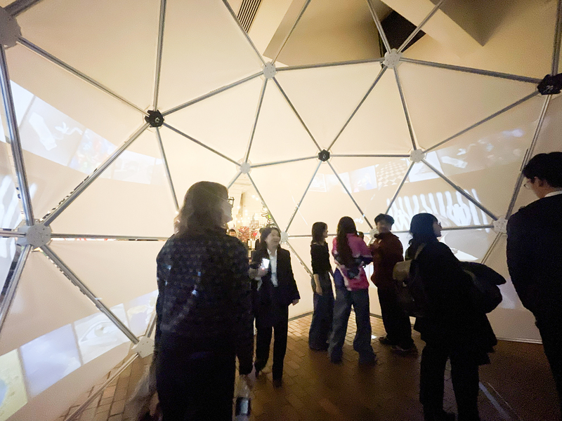 Photo of students viewing the display