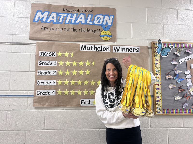 Photo of St. Margaret staff holding up the medals