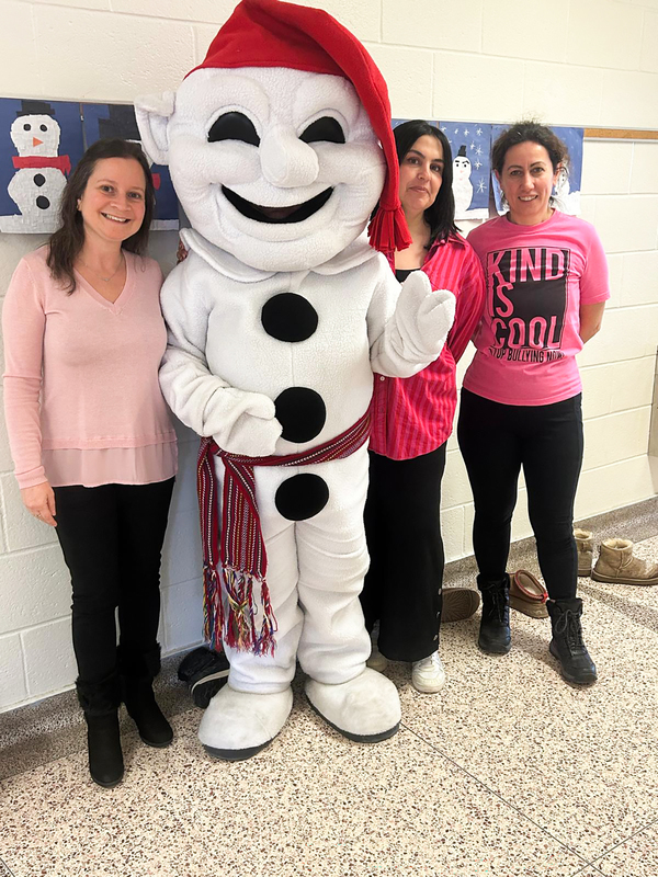 Photo of staff with Bonhomme costume player