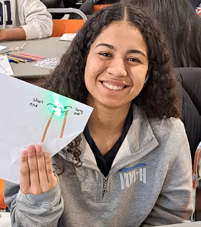 Photo of student trying out one of the activities