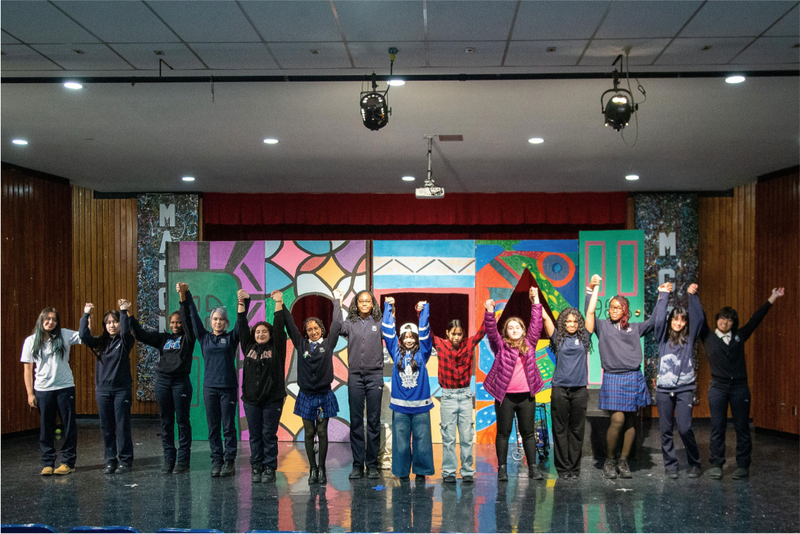 Photo of Madonna drama performers and back end team together on the stage