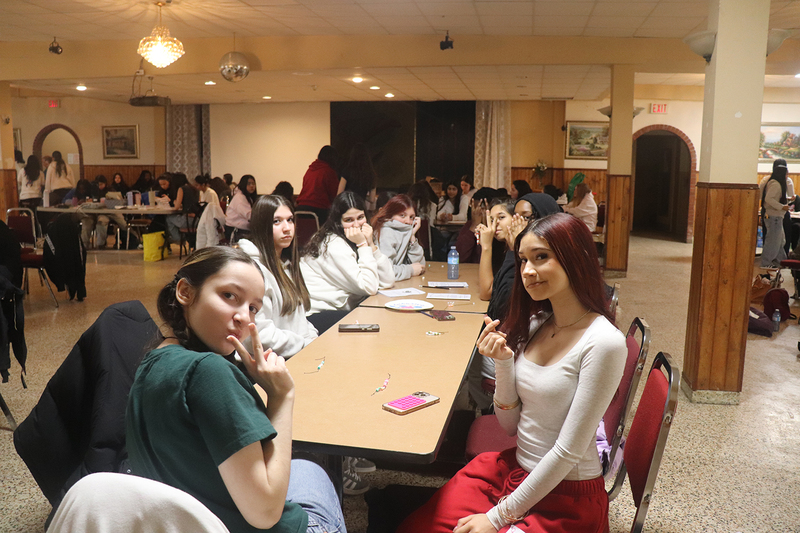 Photo of students making friendship bracelets at the retreat