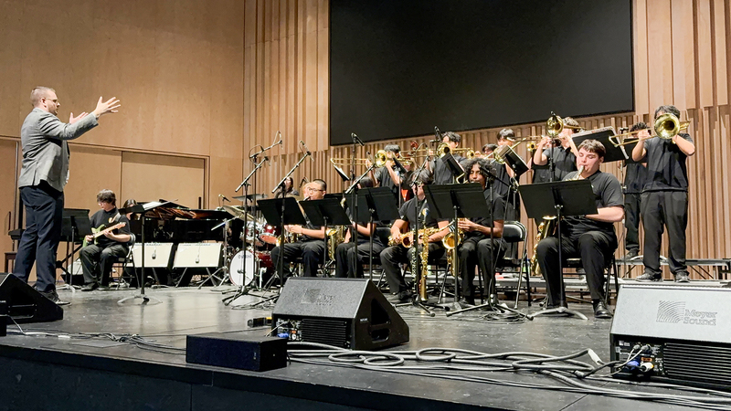Photo of Senator O' Connor musicians performing while being conducted