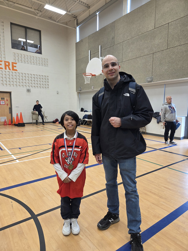 Photo of Adam with his coach