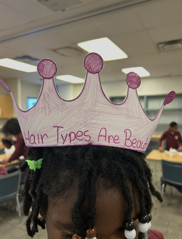 Photo of a student with the crown they designed